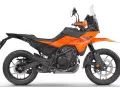 Pomarańczowy motocykl **KTM 390 Adventure** gotowy na przygodę.