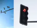 System red light zatrzymuje ruch. Po lewej kamery monitorujące, po prawej czerwone światło sygnalizatora.