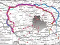 Mapa dróg wokół Warszawy, z zaznaczonymi autostradami, drogami ekspresowymi i innymi drogami krajowymi. Najkorzystniejszy korytarz dk50 oznaczony różowym kolorem.