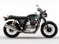 Stylowy Royal Enfield Interceptor 650 w kolorze szaro-zielonym, z chromowanym silnikiem i czarnym, pikowanym siedzeniem, gotowy na każdą podróż.