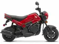 Czerwony skuter Honda Navi z czarnymi akcentami, idealny do miejskich podróży.