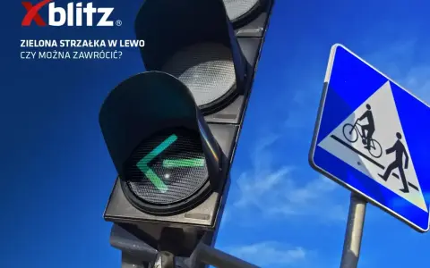 Sygnalizacja świetlna strzałki w lewo świeci na zielono. Obok znak drogi dla rowerzystów i pieszych.