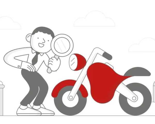 Facet z lupą bada czerwony motocykl, zastanawiając się, ile kosztuje przegląd motocykla.