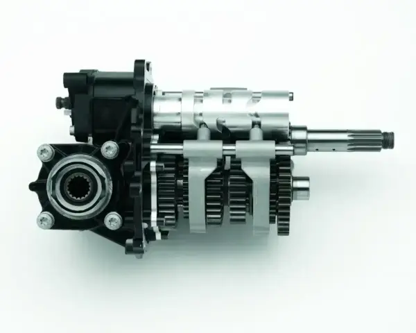 Mechanizm skrzyni biegów z zębatkami i wałkami, umożliwiający płynną zmianę biegów bez sprzęgła.