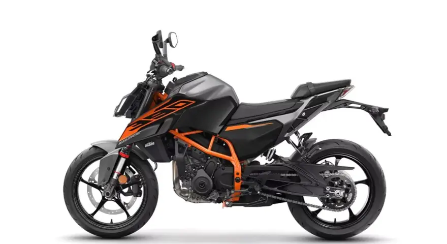 Szary motocykl KTM Duke 390 z pomarańczowymi akcentami, gotowy do osiągnięcia maksymalnej prędkości.