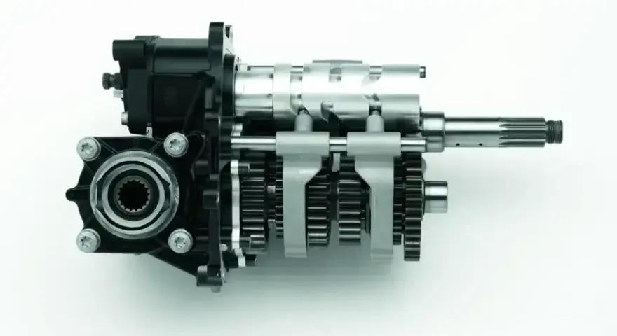 Mechanizm skrzyni biegów z zębatkami i wałkami, umożliwiający płynną zmianę biegów bez sprzęgła.