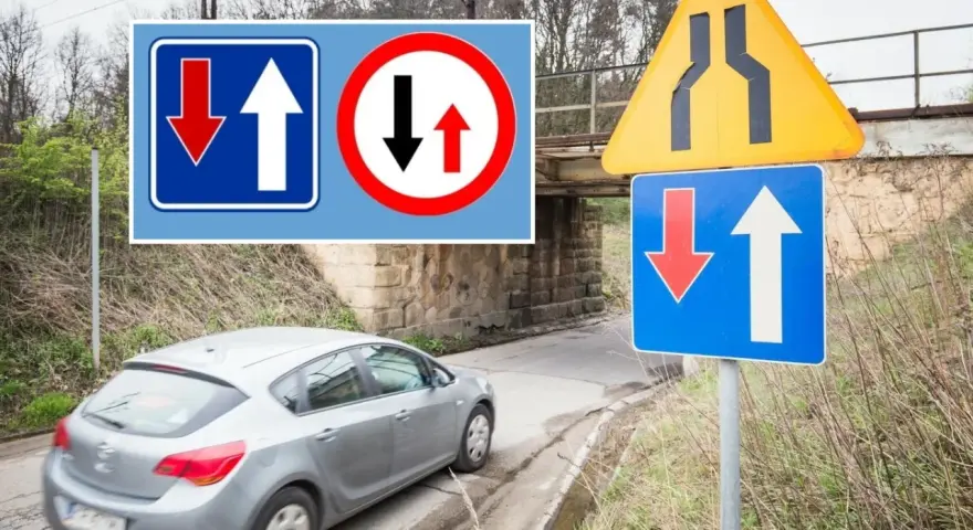 Znaki drogowe informują o pierwszeństwie na zwężonym odcinku jezdni. Samochód zbliża się do miejsca, gdzie ruch jest utrudniony.