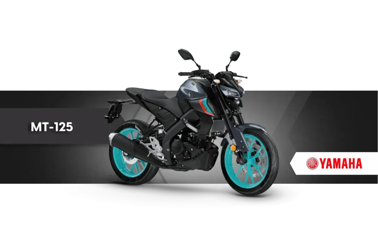 Szary motocykl Yamaha MT-125 z turkusowymi felgami. Idealny na pierwszy motocykl, gdy masz prawo jazdy a1 od ilu lat.