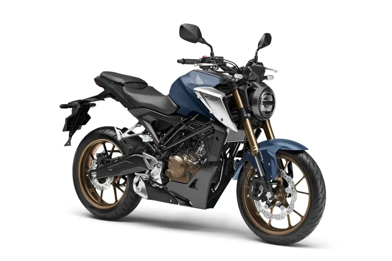 Niebieski motocykl Honda CB125R, najszybsza 125 na rynku, z brązowymi felgami i nowoczesnym designem.