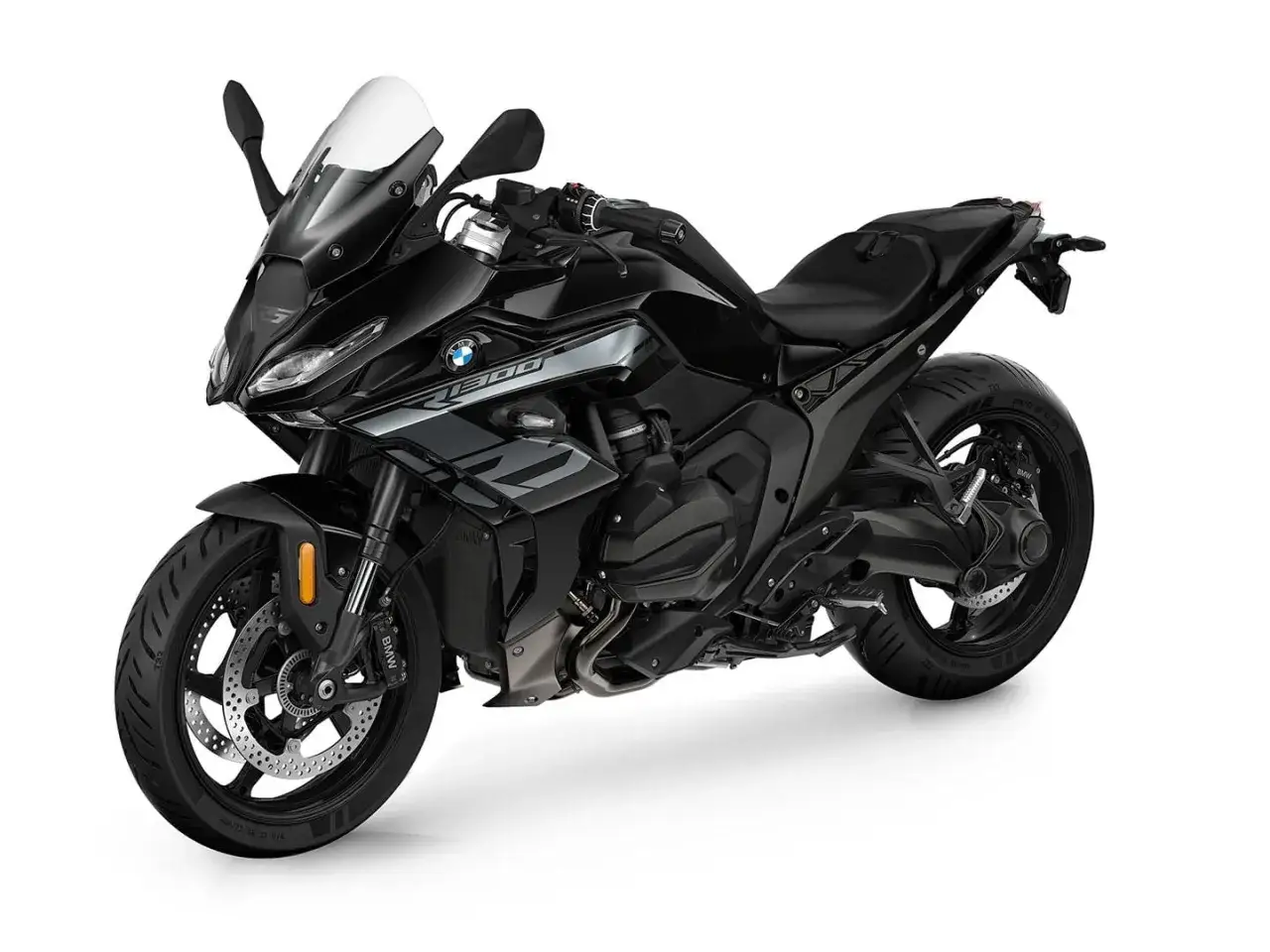 Czarny motocykl BMW R1300GS z białą owiewką, gotowy na przygodę.